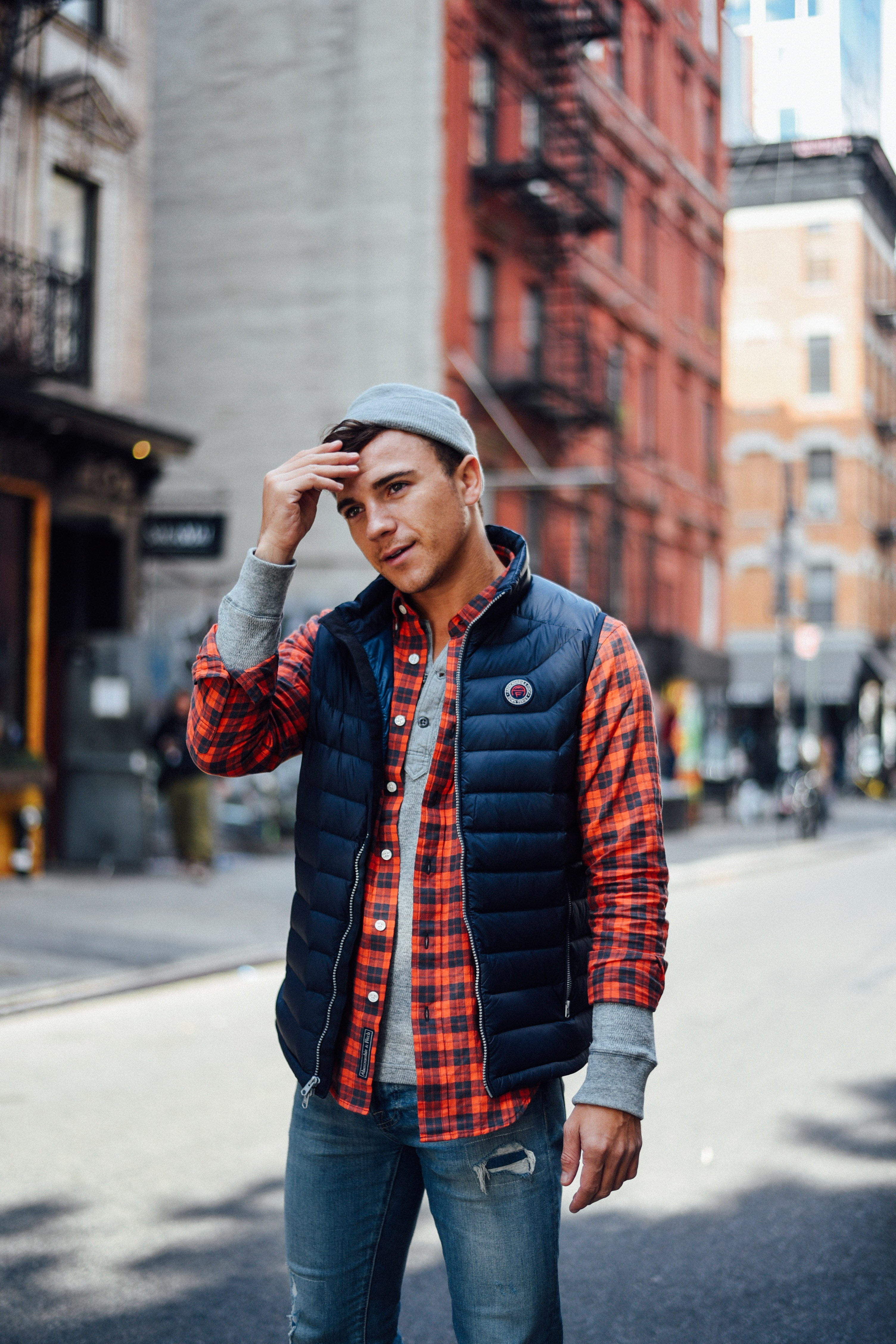 Men's Fashion Blogger Justin Livingston wears Abercrombie Men's Denim Plaid Shirt Puffer Vest in New York City