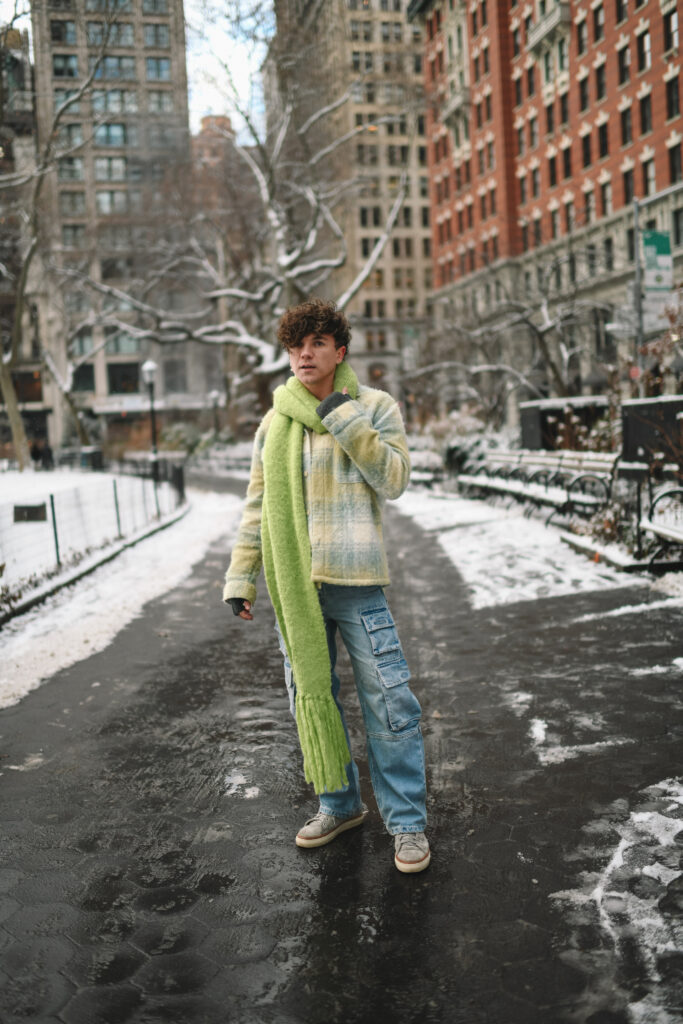 Scout Sixteen - Justin Livingston. Men's Winter Style. Cargo Denmi with Pastel Spring Coat and Lime Green Scarf. NYC.