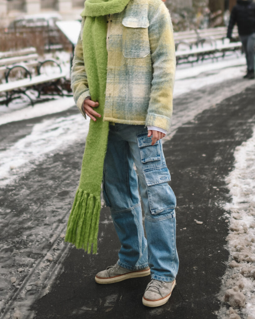 Scout Sixteen - Justin Livingston. Men's Winter Style. Cargo Denmi with Pastel Spring Coat and Lime Green Scarf. NYC.