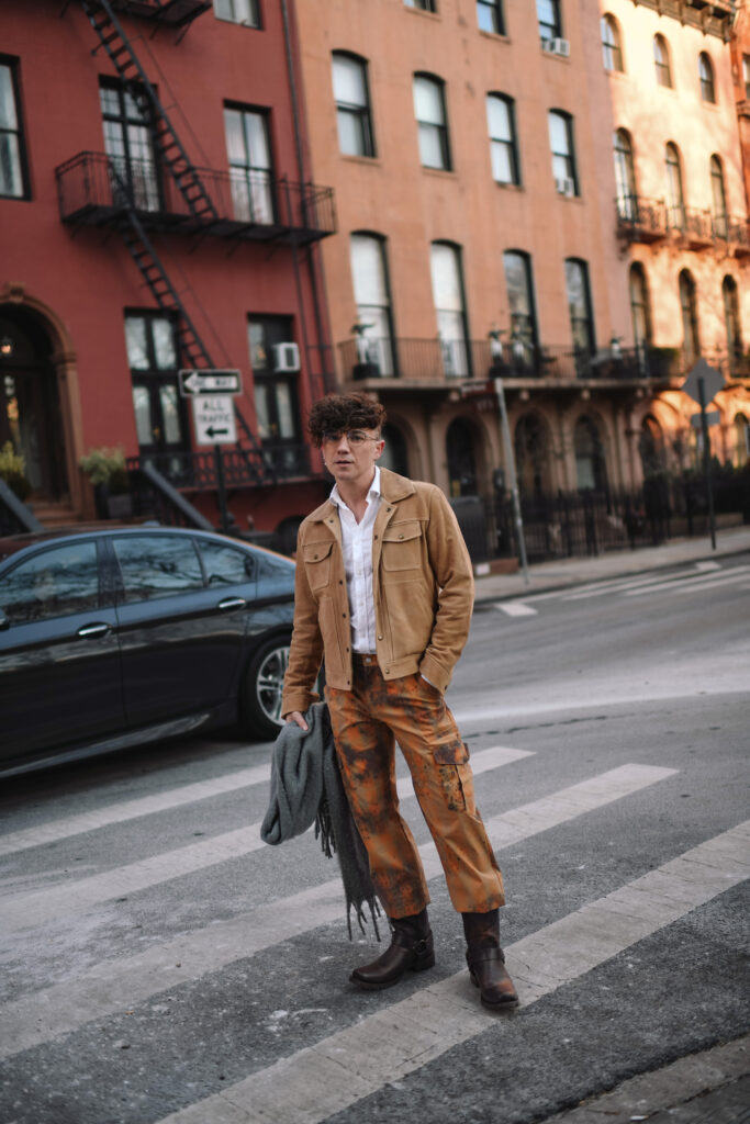 Scout Sixteen - Justin Livingston wears camouflage cargo pants with a men's camel suede jacket from Banana Republic and brown Stetson Heritage Harness Western Boots. NYC Men's Winter Style.