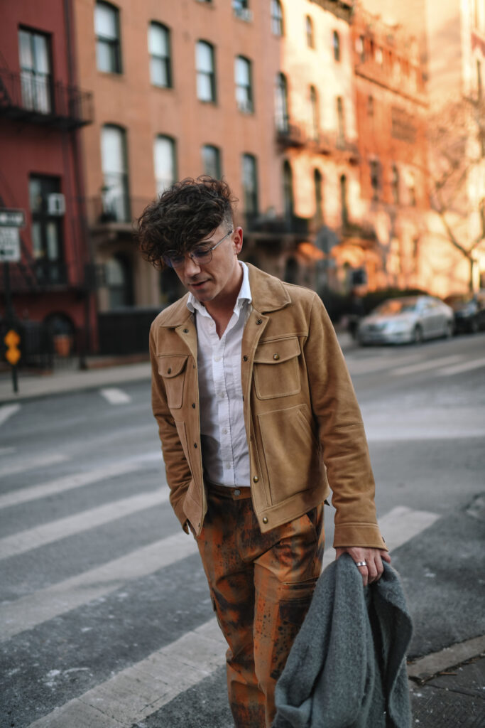 Scout Sixteen - Justin Livingston wears camouflage cargo pants with a men's camel suede jacket from Banana Republic and brown Stetson Heritage Harness Western Boots. NYC Men's Winter Style.