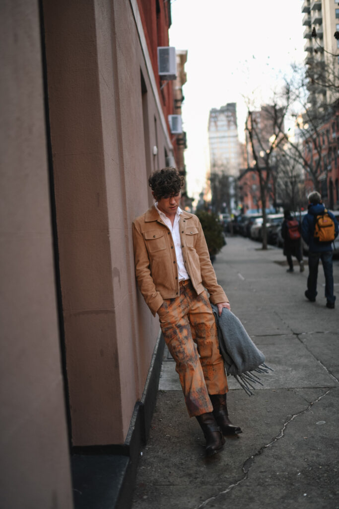 Scout Sixteen - Justin Livingston wears camouflage cargo pants with a men's camel suede jacket from Banana Republic and brown Stetson Heritage Harness Western Boots. NYC Men's Winter Style.