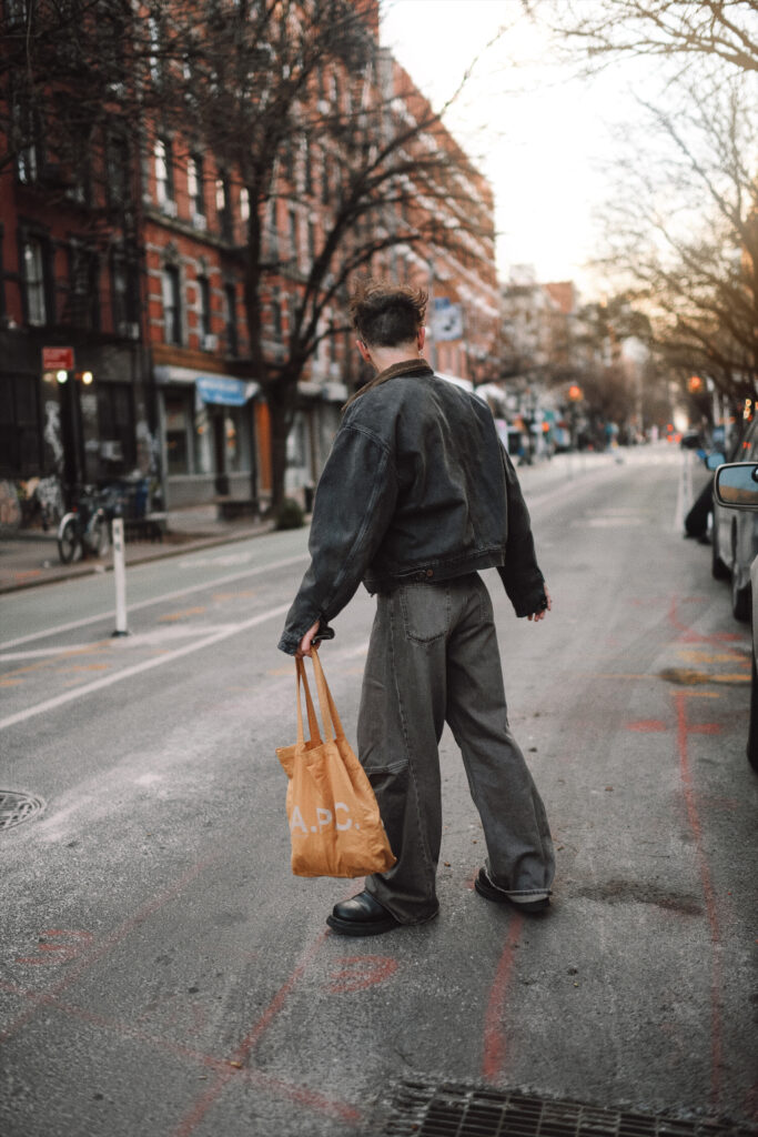 Scout Sixteen - Justin Livingston. Men's Fashion. Yeezy Denim Jacket, Ultra Wide Leg Jeans, Black Henley Tee, Bottega Veneta Black Boots