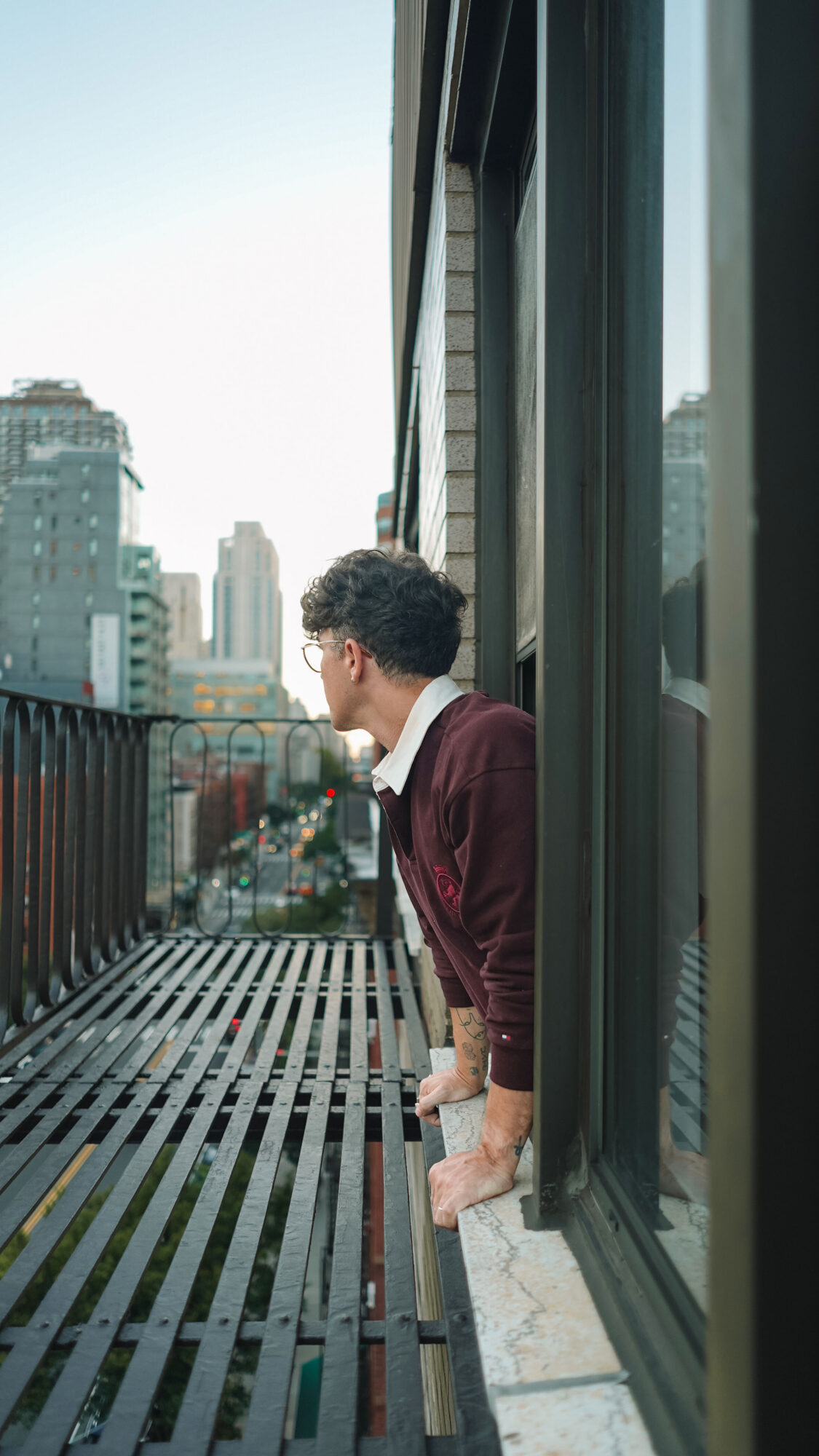 Scout Sixteen / Justin Livingston (justinliv) NYC Men's Fashion Inspiration - Maroon Men's Rugby Shirt Tommy Hilfiger, Men's Striped Blue Jeans Pants, Men's White Leather Sneakers Thursday Boots, New York City Skyline